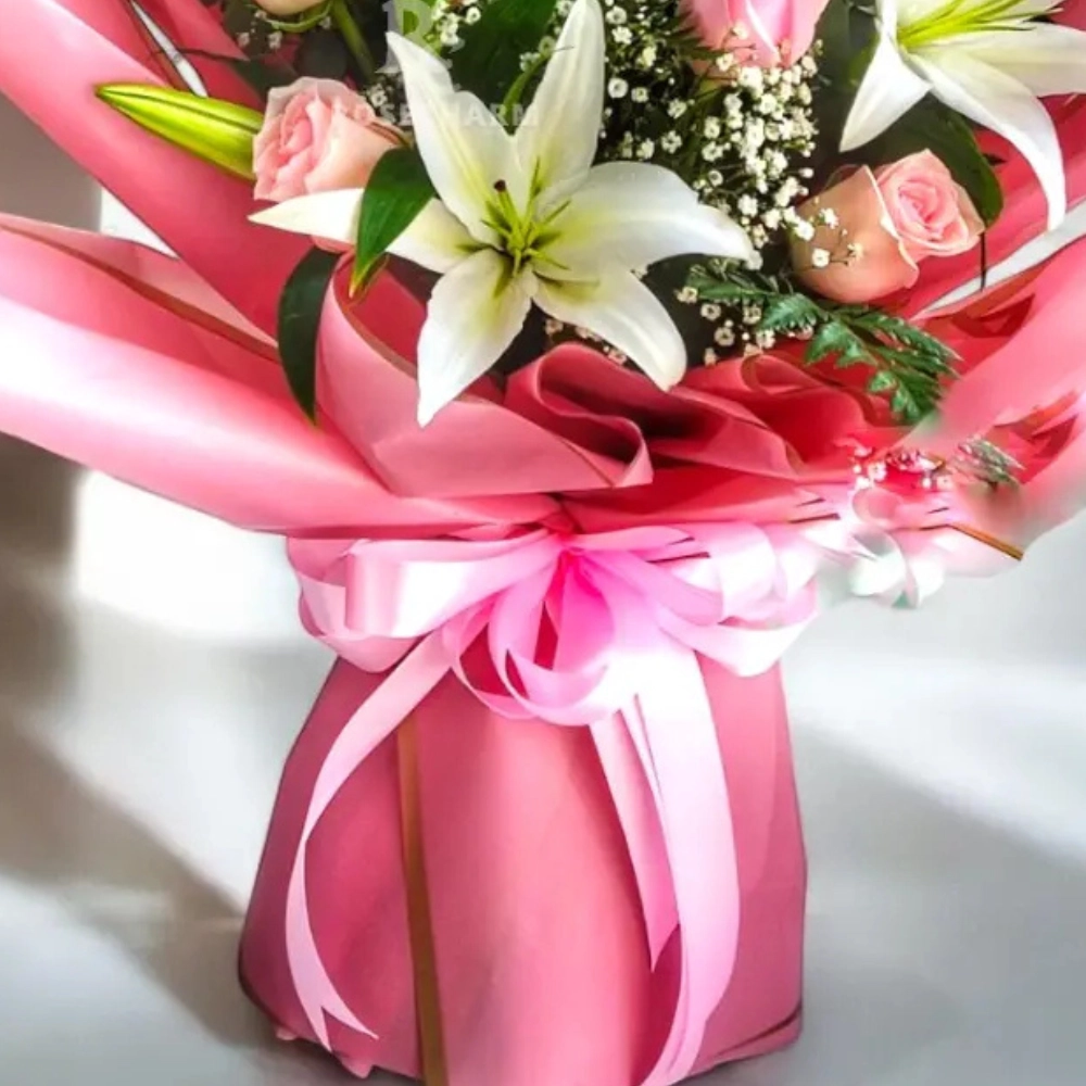 Bouquet of pink roses and lilies in a nice wrapping