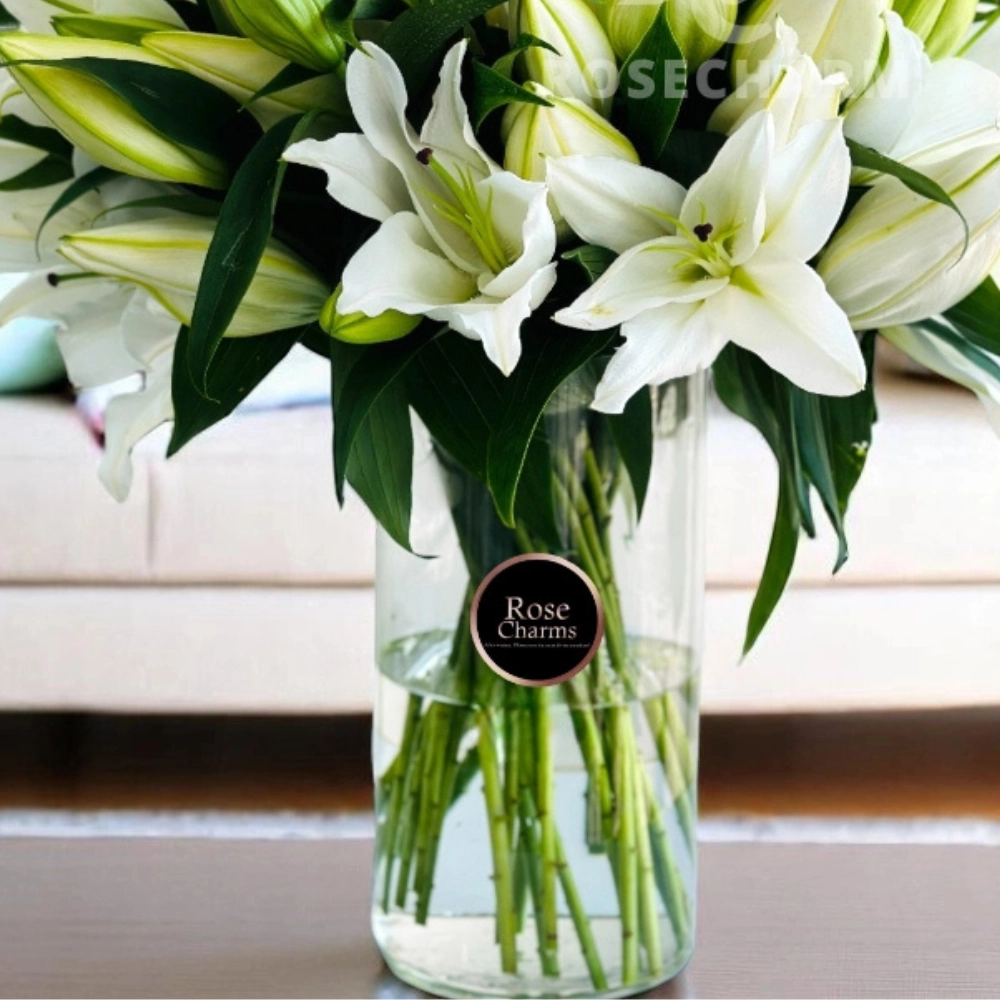 Arrangement of 10 white lilies in a glass vase