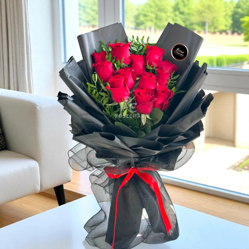 A bouquet of 12 red roses with fillers in a nice wrapping