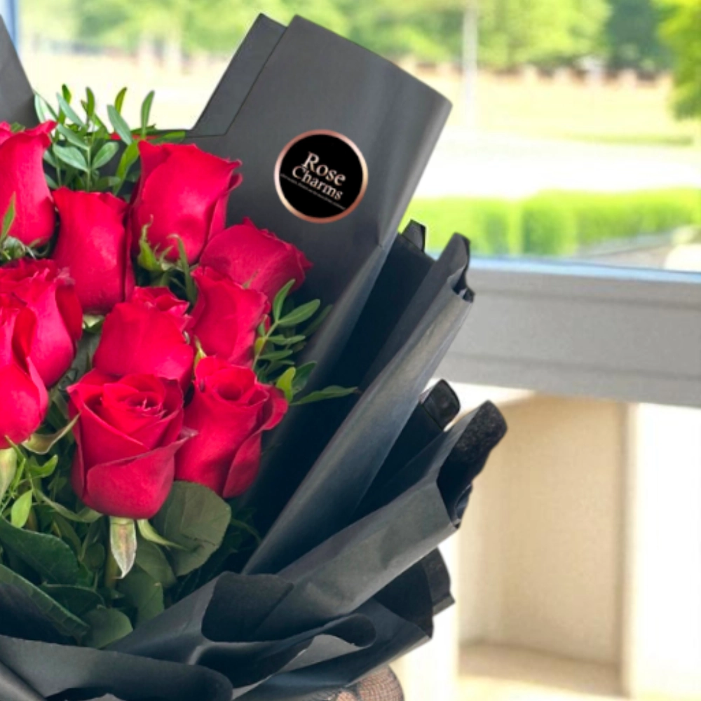 A bouquet of 12 red roses with fillers in a nice wrapping