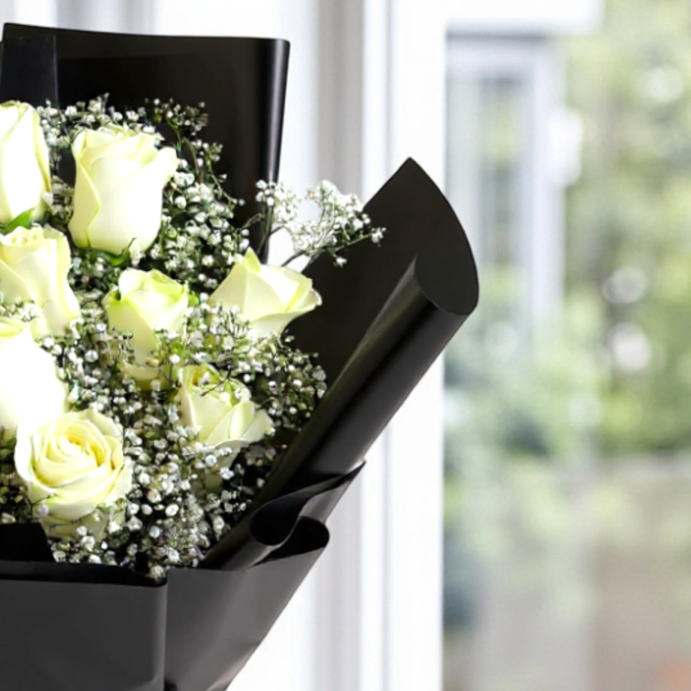 A bouquet of 12 white roses with nice wrapping