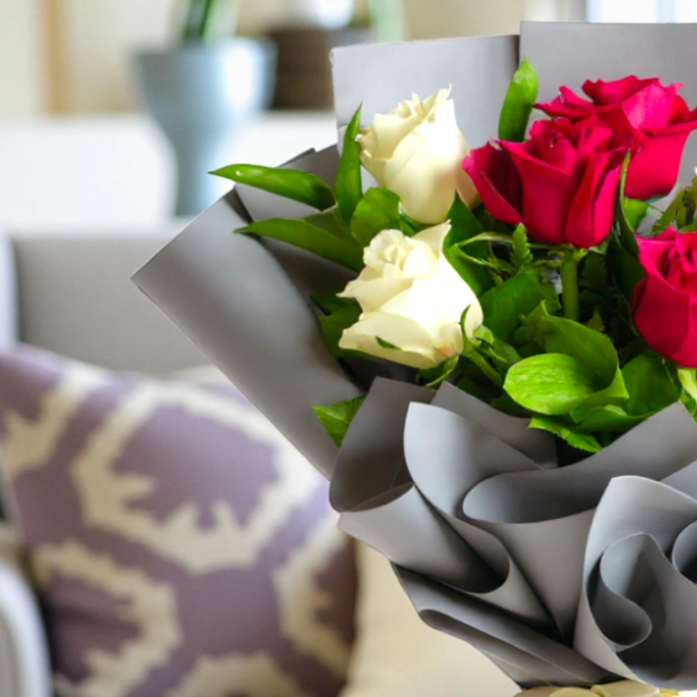 A bouquet of 6 red and white roses in a nice wrapping