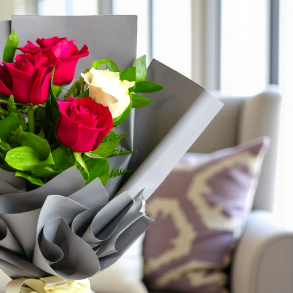 A bouquet of 6 red and white roses in a nice wrapping