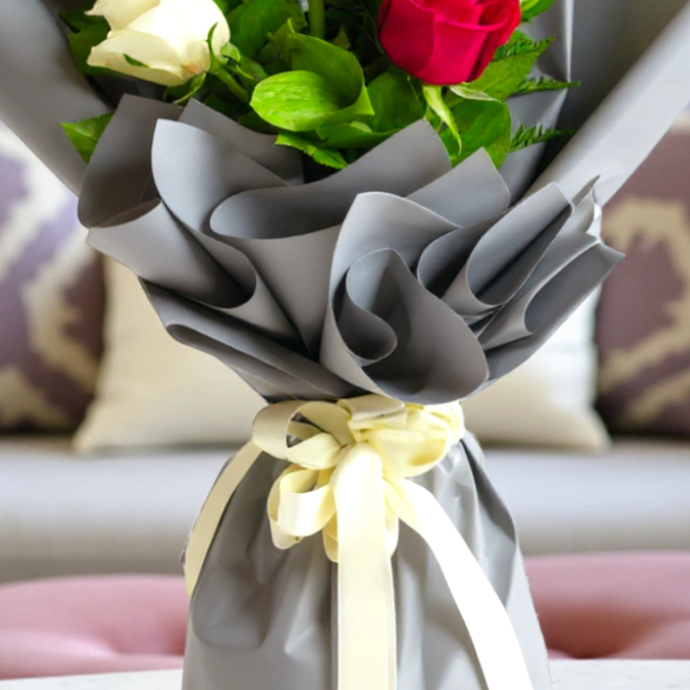 A bouquet of 6 red and white roses in a nice wrapping