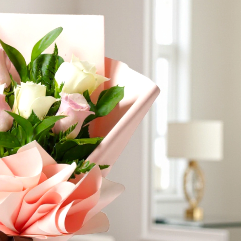 A bouquet of 6 white and pink roses in a nice wrapping