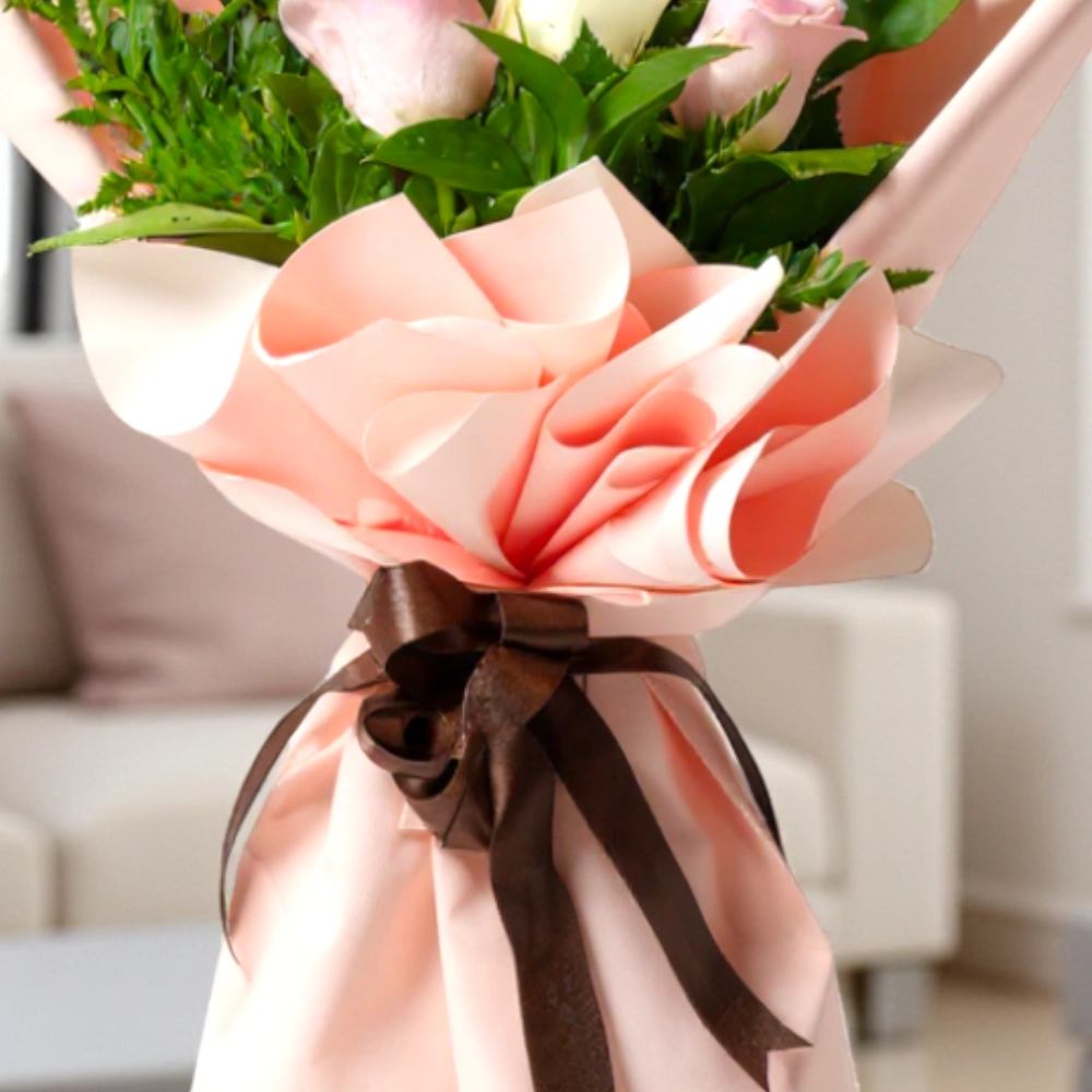 A bouquet of 6 white and pink roses in a nice wrapping