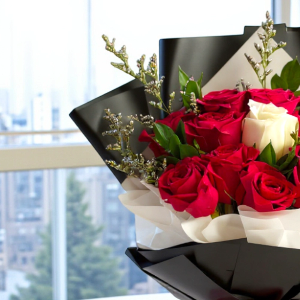 Bouquet of 12 red roses and 1 white rose in a nice wrapping