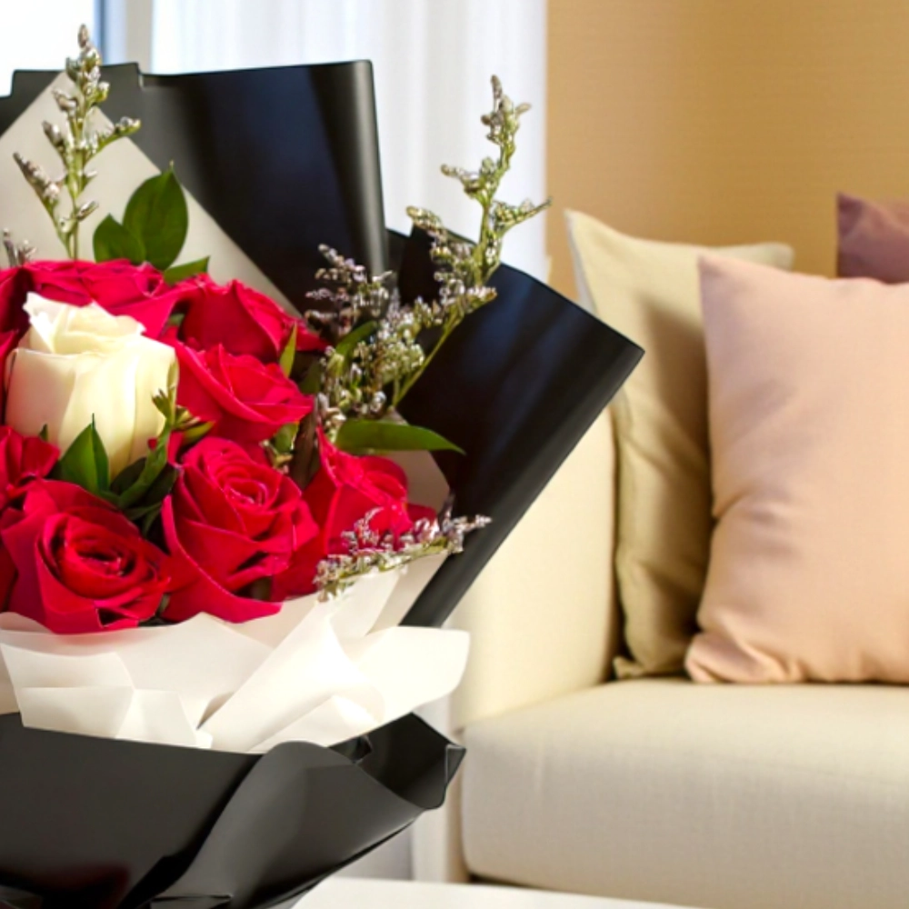 Bouquet of 12 red roses and 1 white rose in a nice wrapping