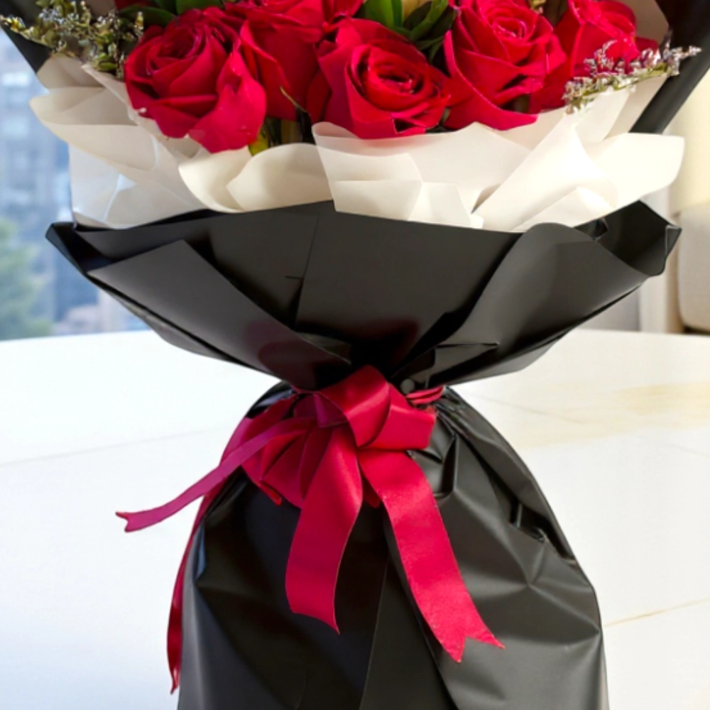 Bouquet of 12 red roses and 1 white rose in a nice wrapping
