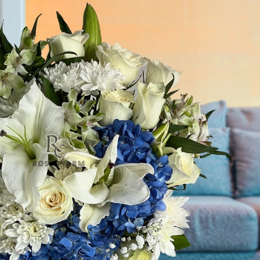 white and blue flowers arrangement