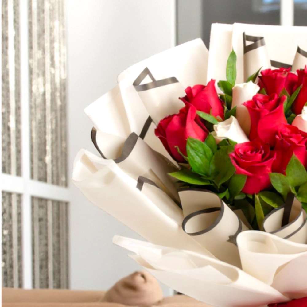 A bouquet of 9 red roses and 3 white roses