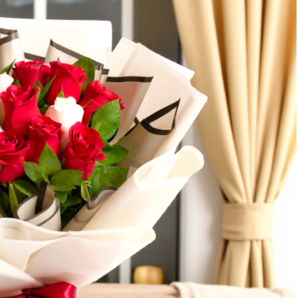 A bouquet of 9 red roses and 3 white roses