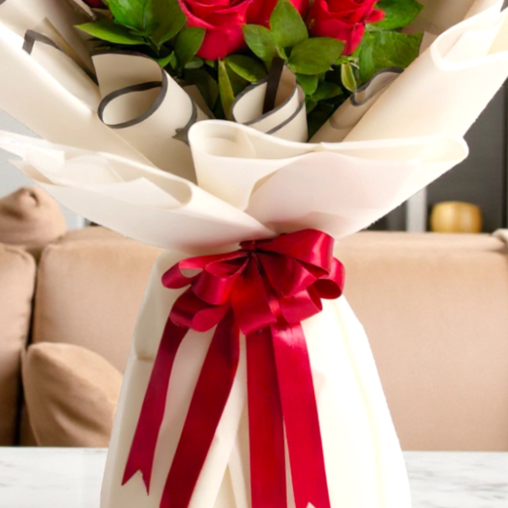 A bouquet of 9 red roses and 3 white roses