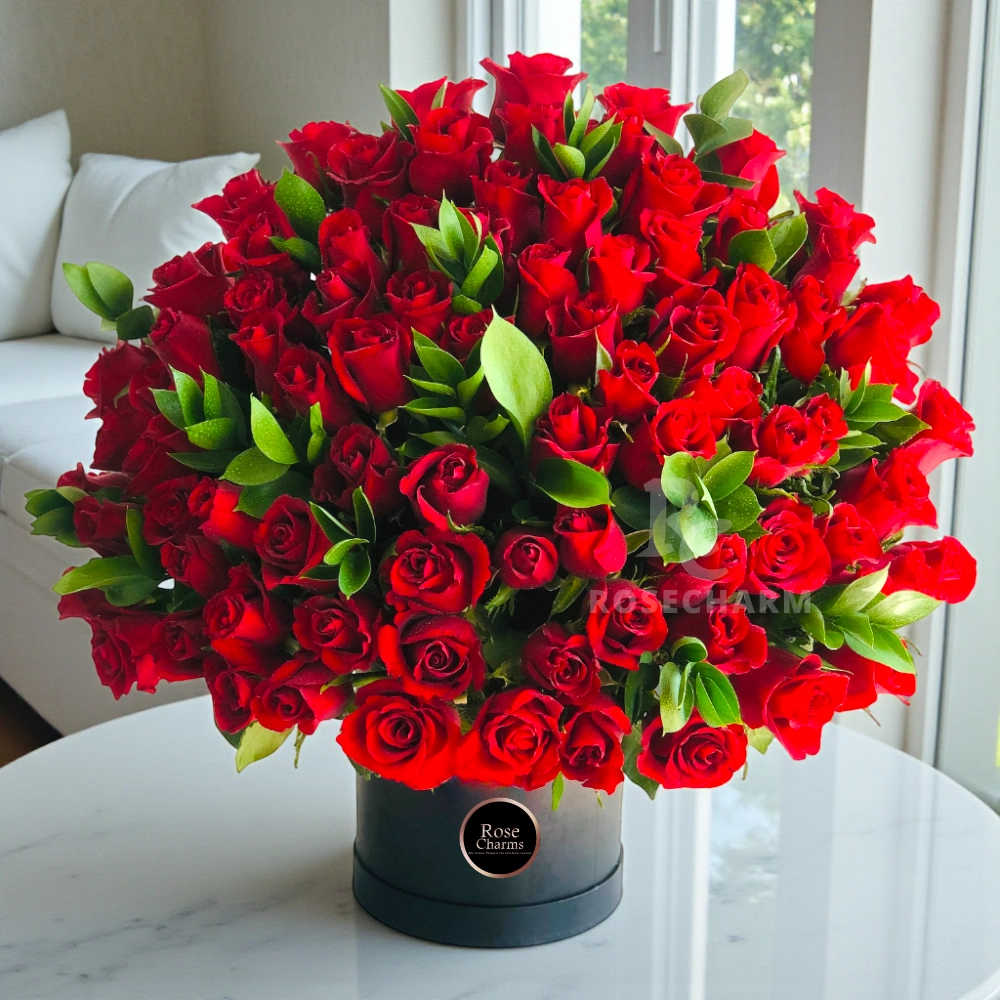 Arrangement of 100 red roses in a black box