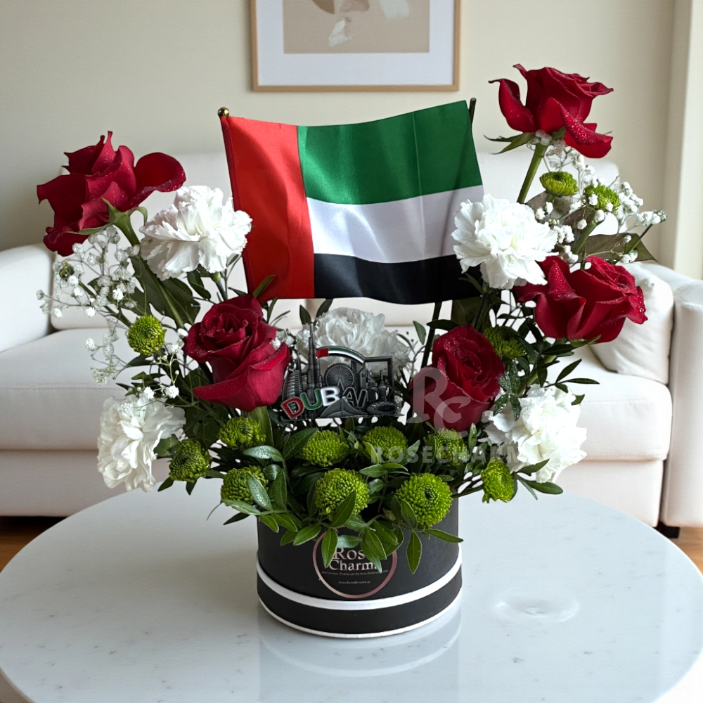 Arrangement of UAE color roses and chrysanthemum in a box