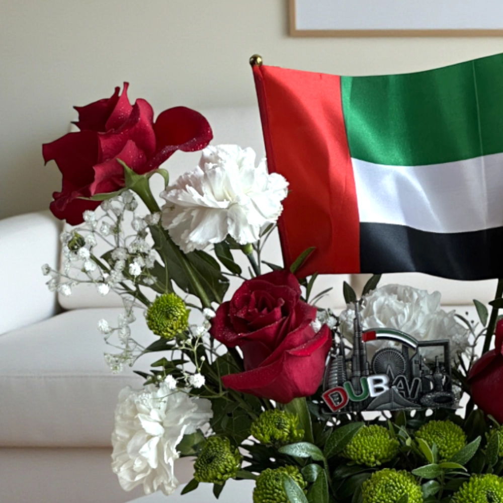 Arrangement of UAE color roses and chrysanthemum in a box