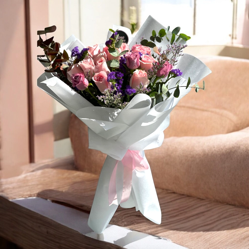 pink and purple roses bouquet in a nice wrapping