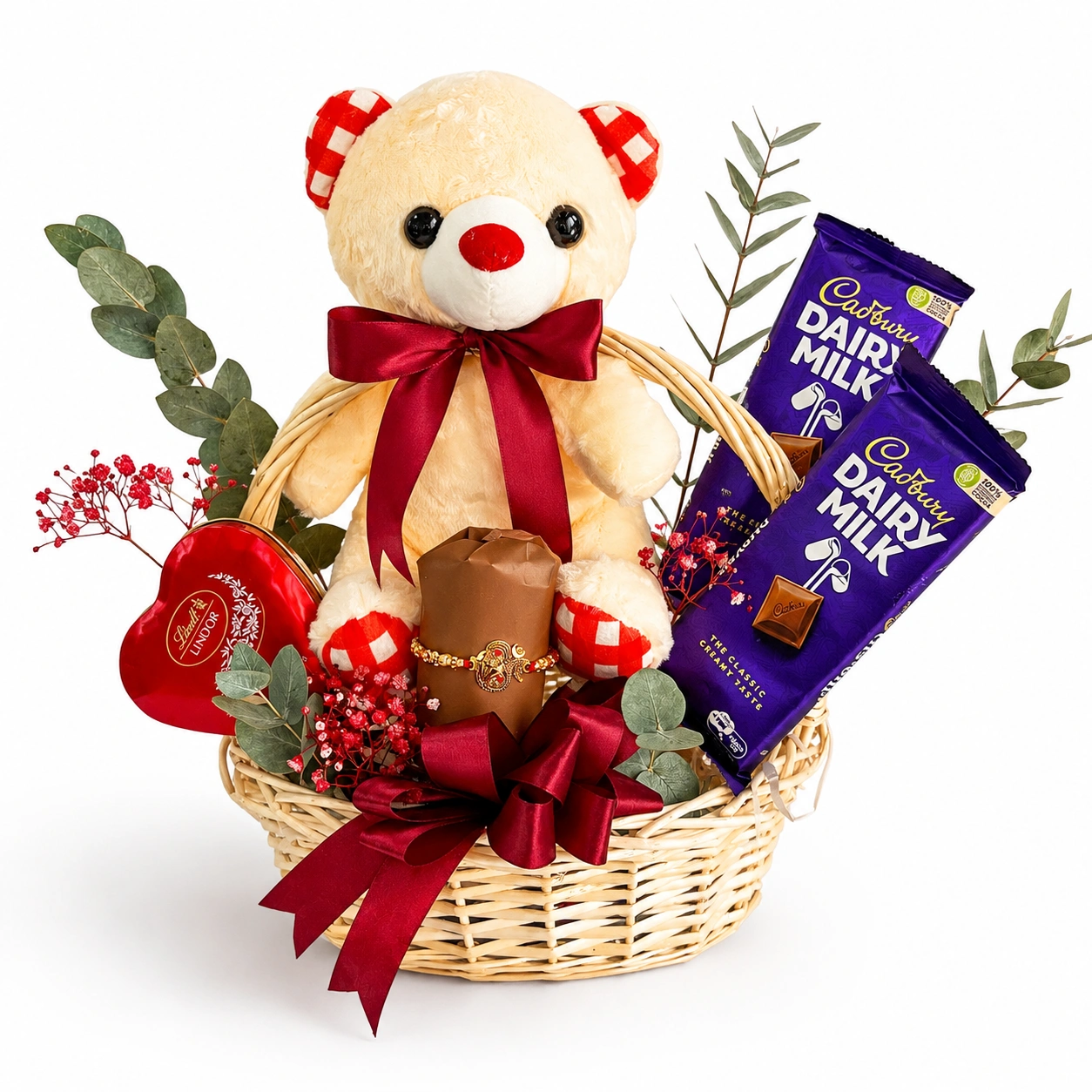 Rakhi Sweet Moments Gift Basket Hamper with Dairy Milk chocolates, heart shaped Lindt chocolate, teddy bear and designer Rakhi