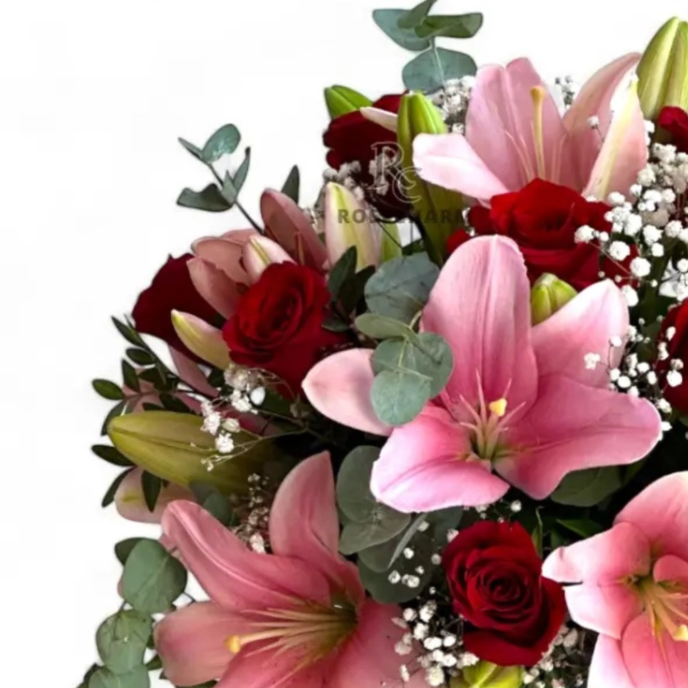 Arrangement of red roses & pink lilies in a box