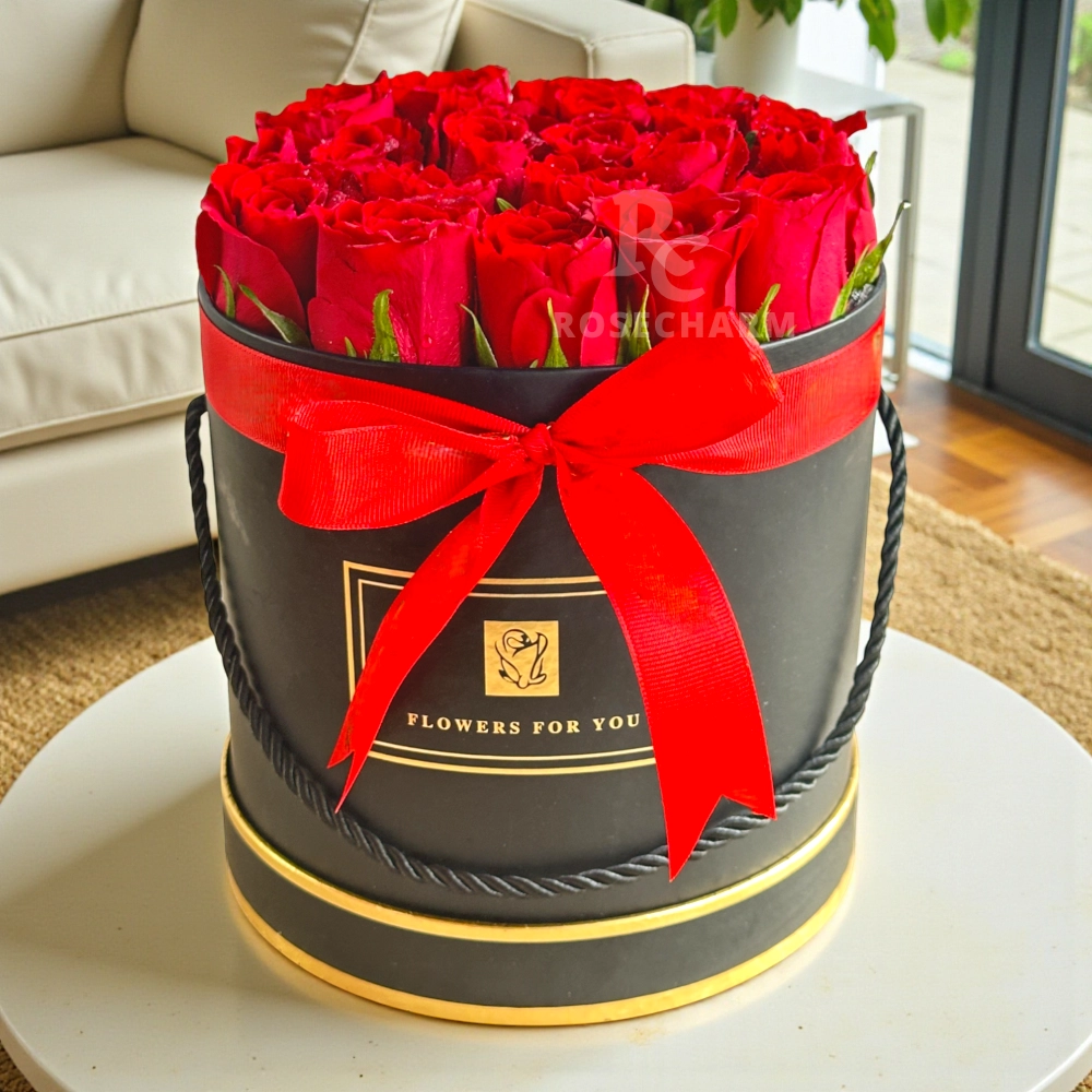 Arrangement of 20 red roses in a black box